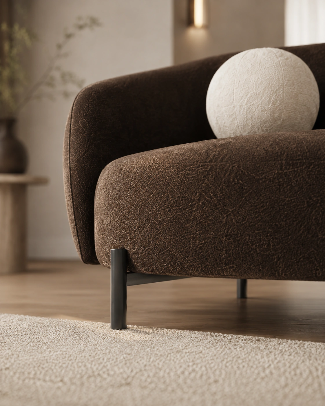 Low-angle view of a dark chocolate curved sofa