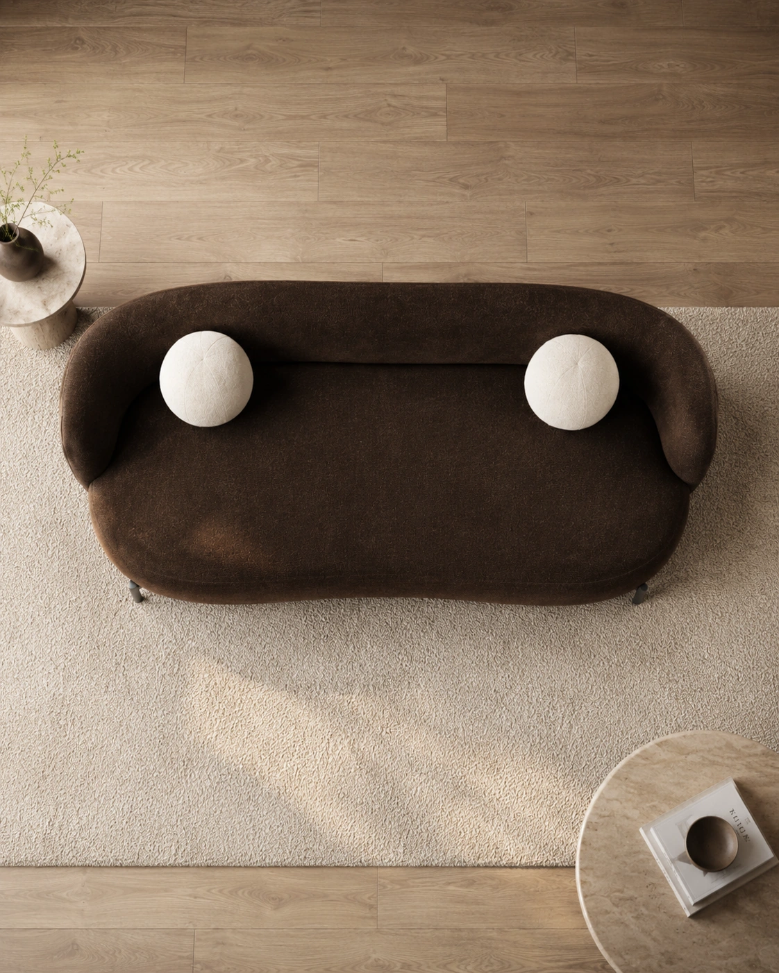Top view of the chocolate sofa with two ivory sphere cushions