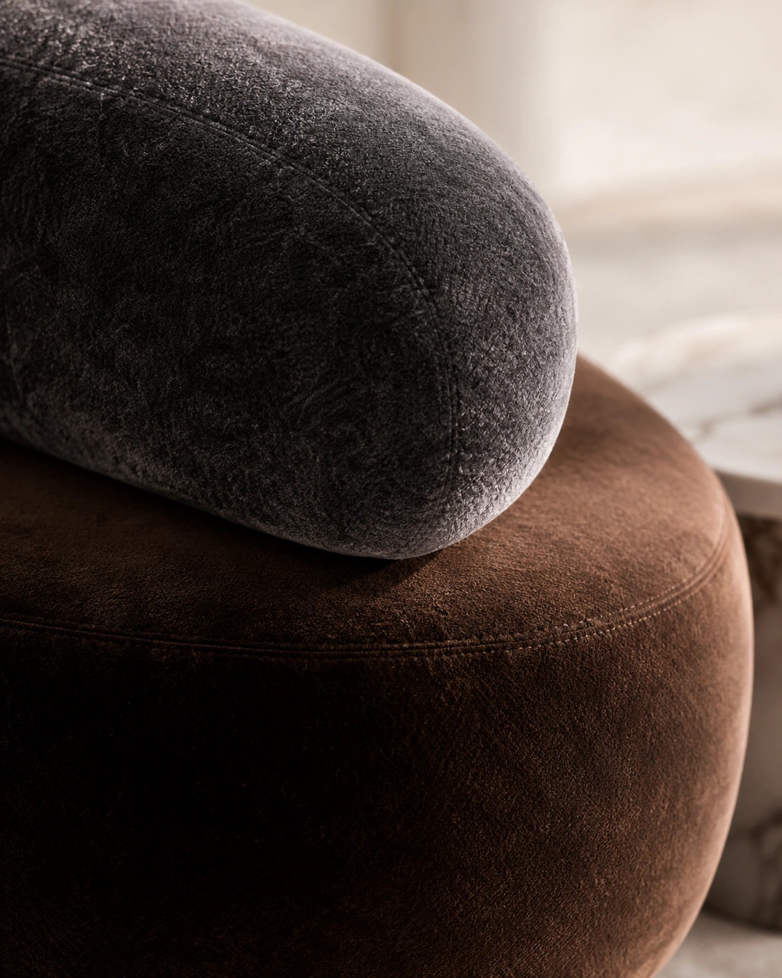 Close detail of charcoal and chocolate velvet upholstery